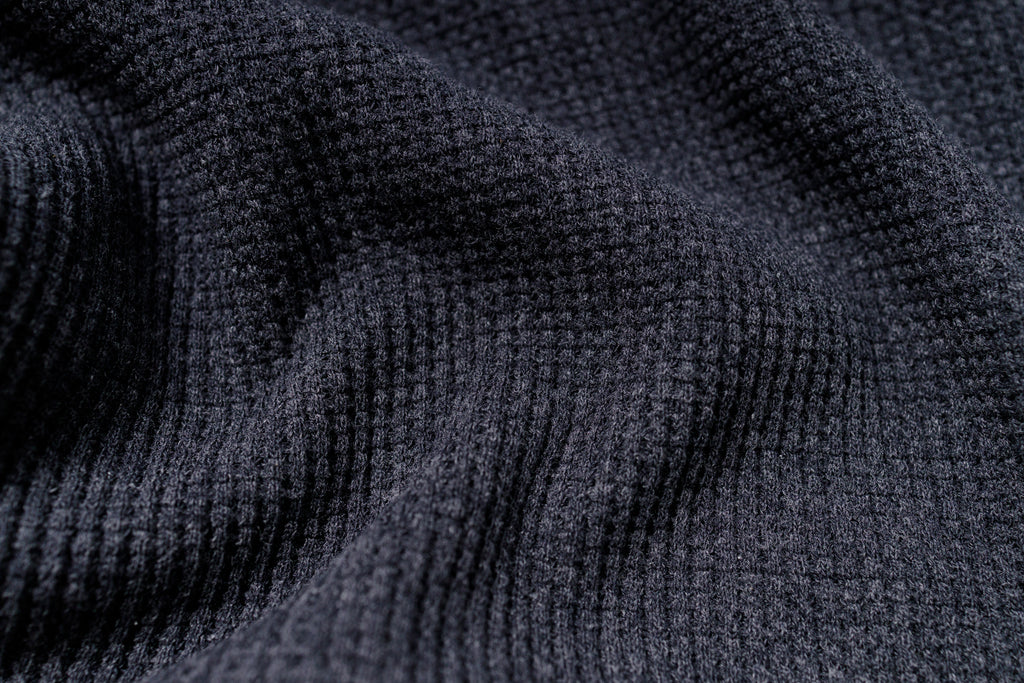 Close-up of dark gray textured fabric