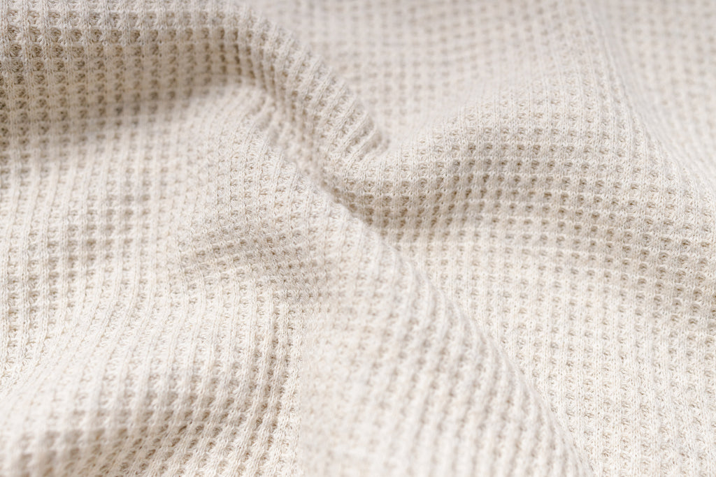 Close-up of beige textured fabric