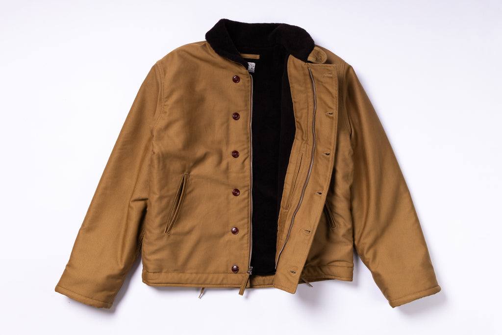 Brown jacket with black lining on a white background
