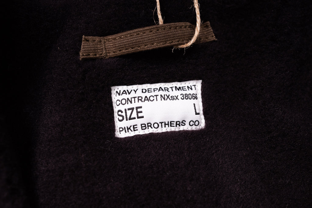 Label on a black fabric with text and 'Pike Brothers Co.' branding