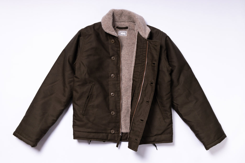 Brown jacket with gray lining on a white background