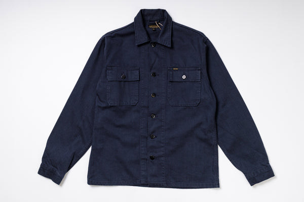 Navy blue shirt with button details on a white background