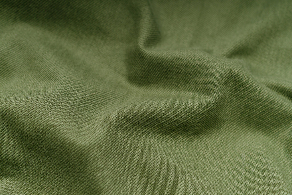 Close-up of green fabric with folds