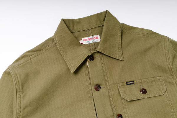 Green shirt with collar and button details on a white background