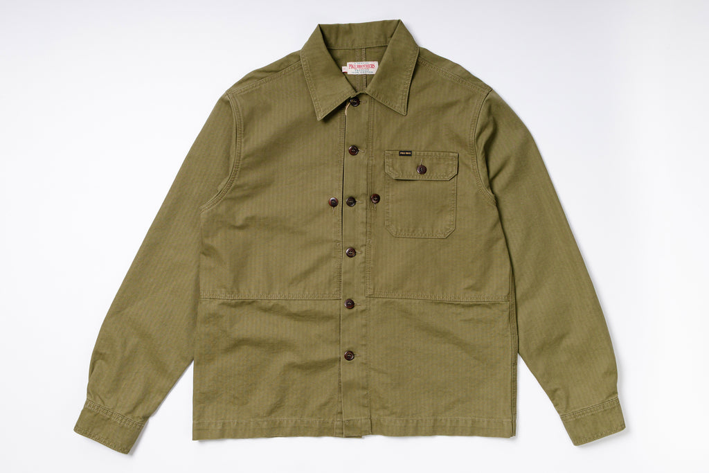 Green jacket with button details on a white background