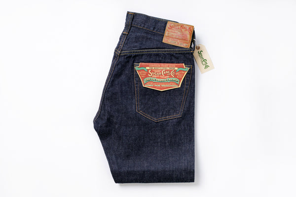 Folded pair of blue jeans with Levi's branding on a white background