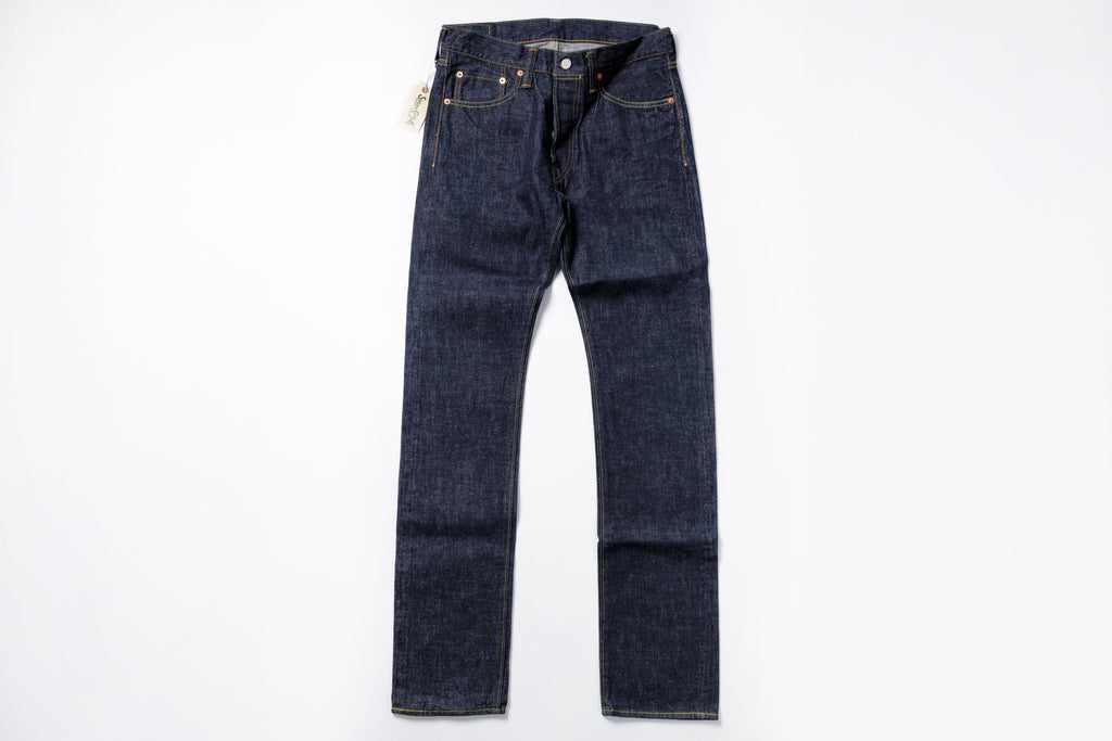 Pair of dark blue jeans on a white background