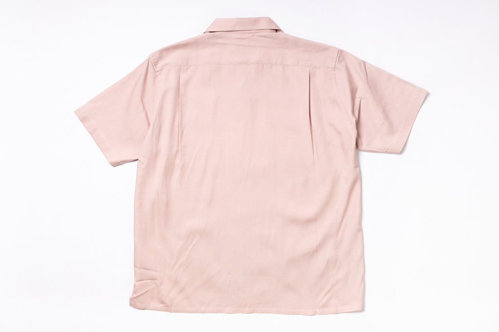 Pink short-sleeve shirt on a white background