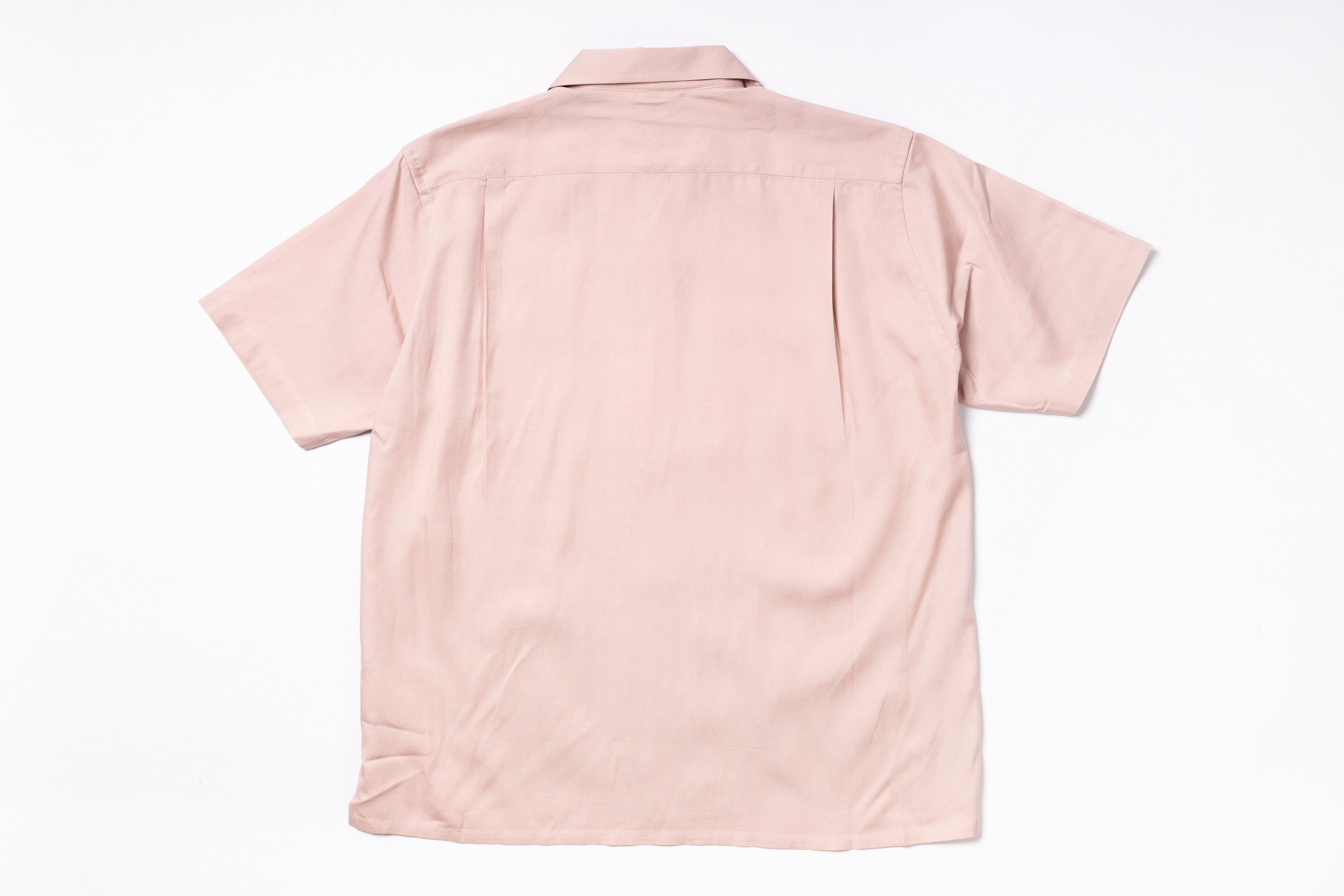 Pink short-sleeve shirt on a white background
