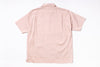 Pink short-sleeve shirt on a white background