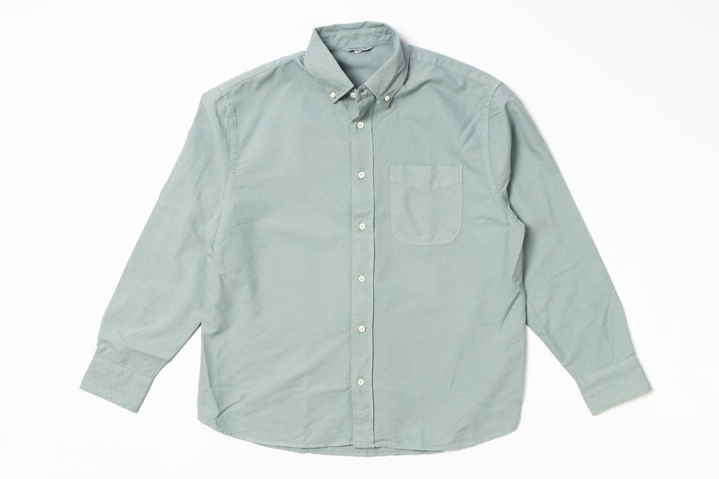 Light green button-up shirt on a white background