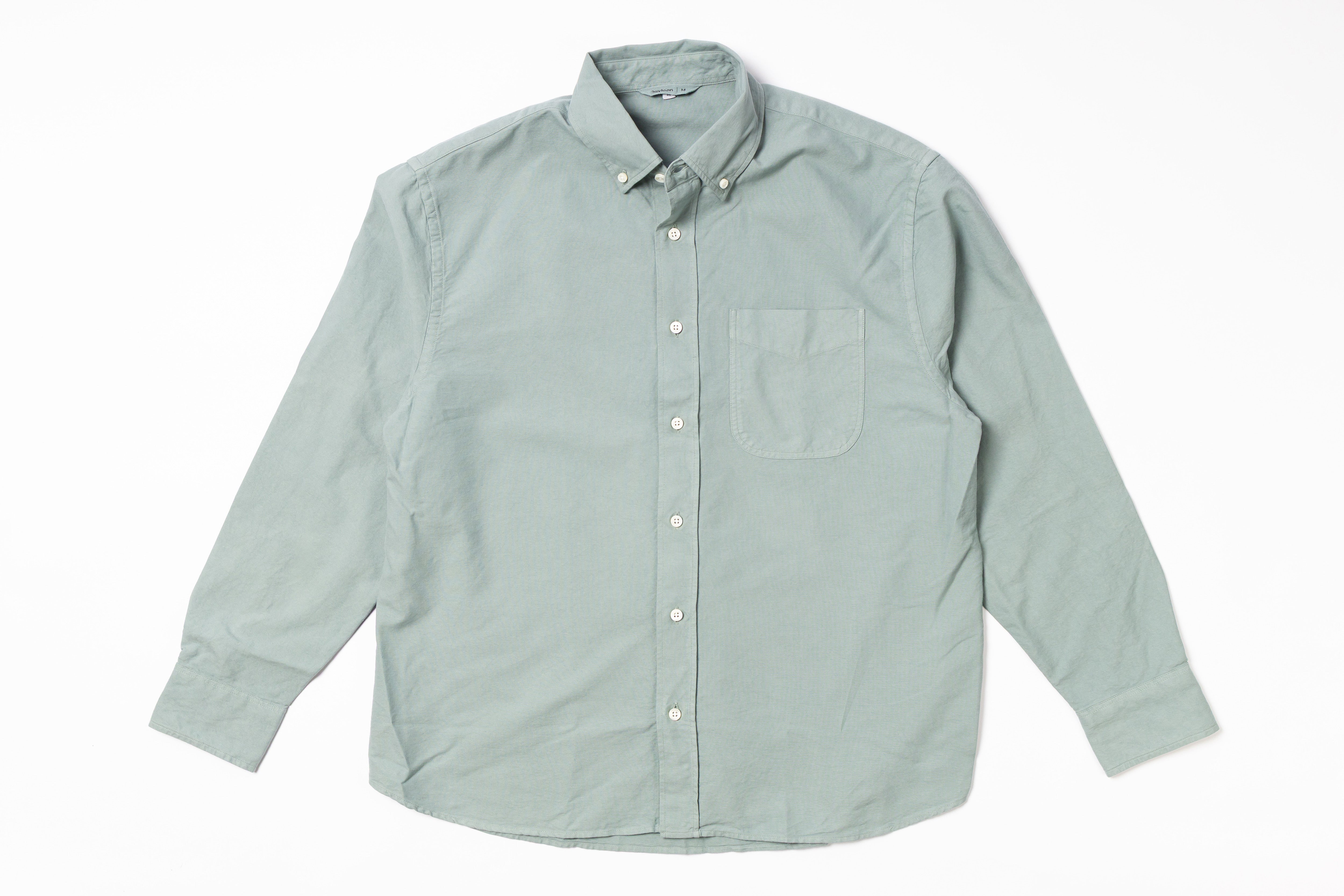 Light green button-up shirt on a white background