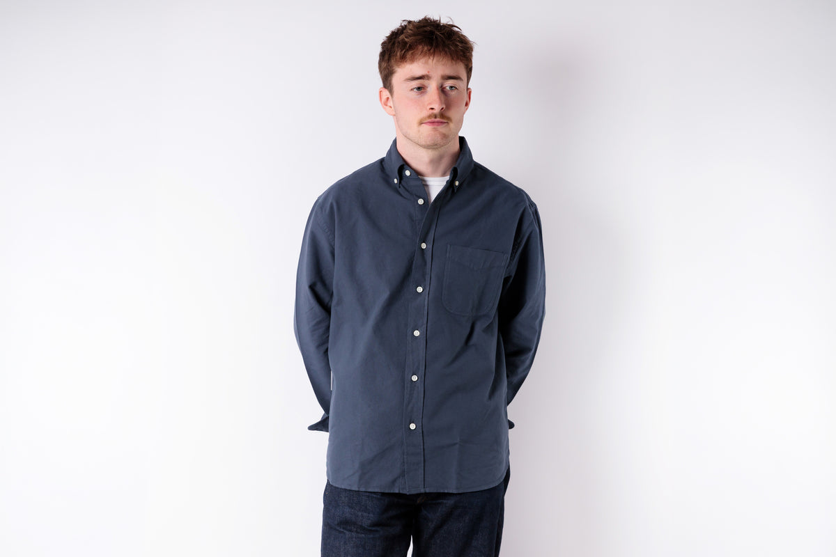 Man wearing a blue jacket on a white background