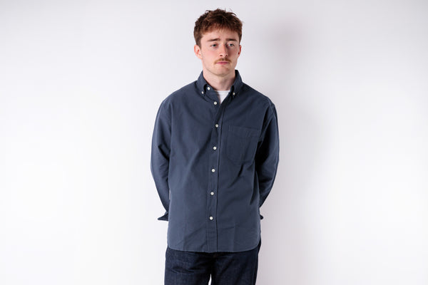 Man wearing a blue jacket on a white background