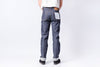 Person wearing blue jeans on a white background