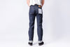 Person wearing blue jeans on a white background