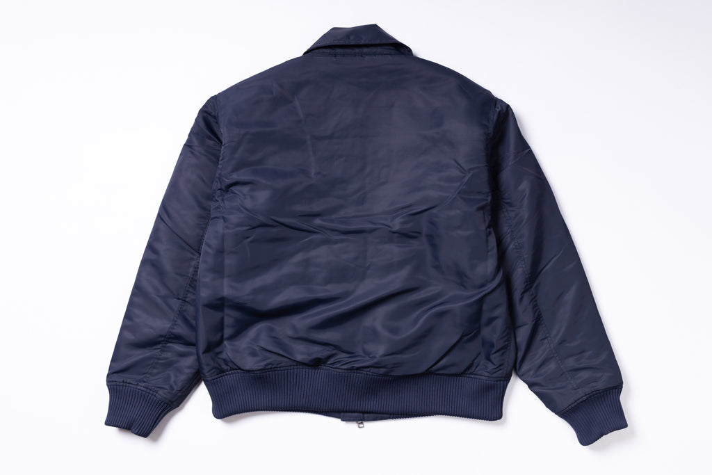 Navy blue bomber jacket on a white background