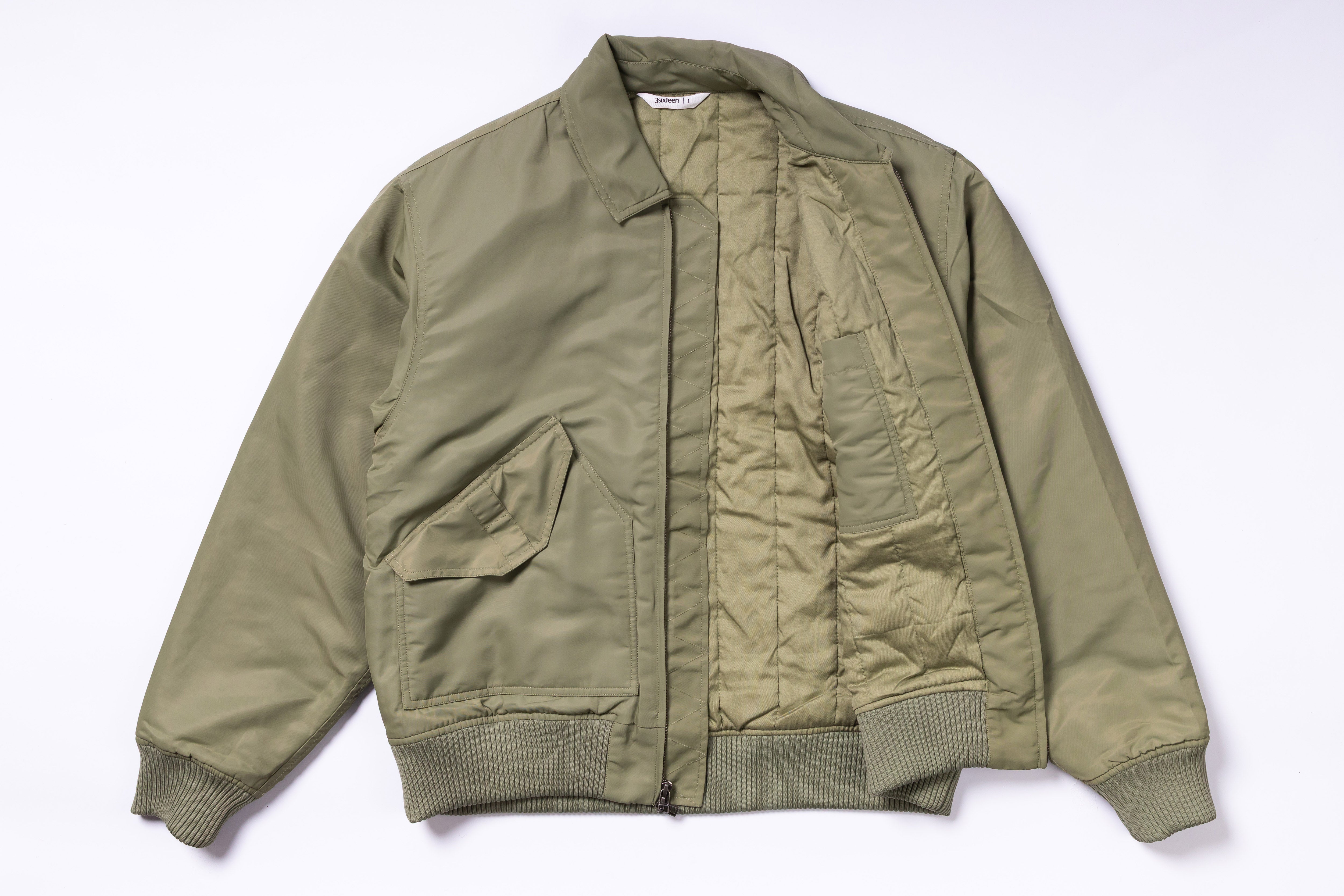 Green bomber jacket on a white background