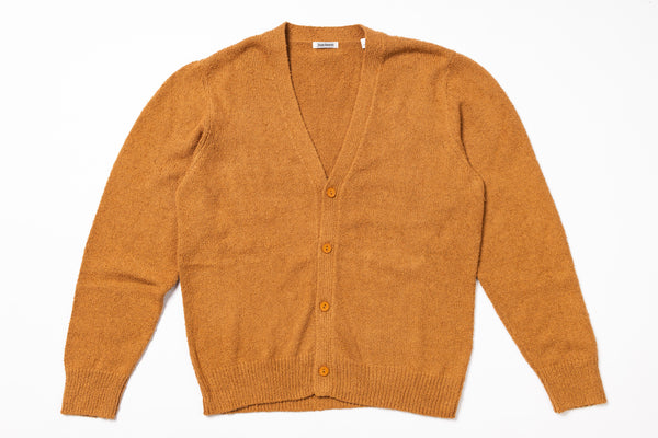 Orange cardigan on a white background