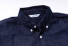 Navy blue shirt with collar and buttons on a white background