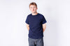 Person wearing a navy blue t-shirt on a white background