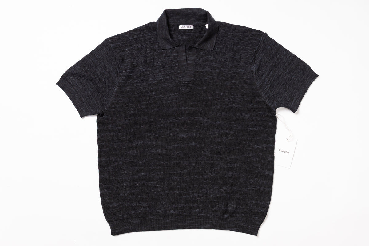 Dark gray polo shirt on a white background