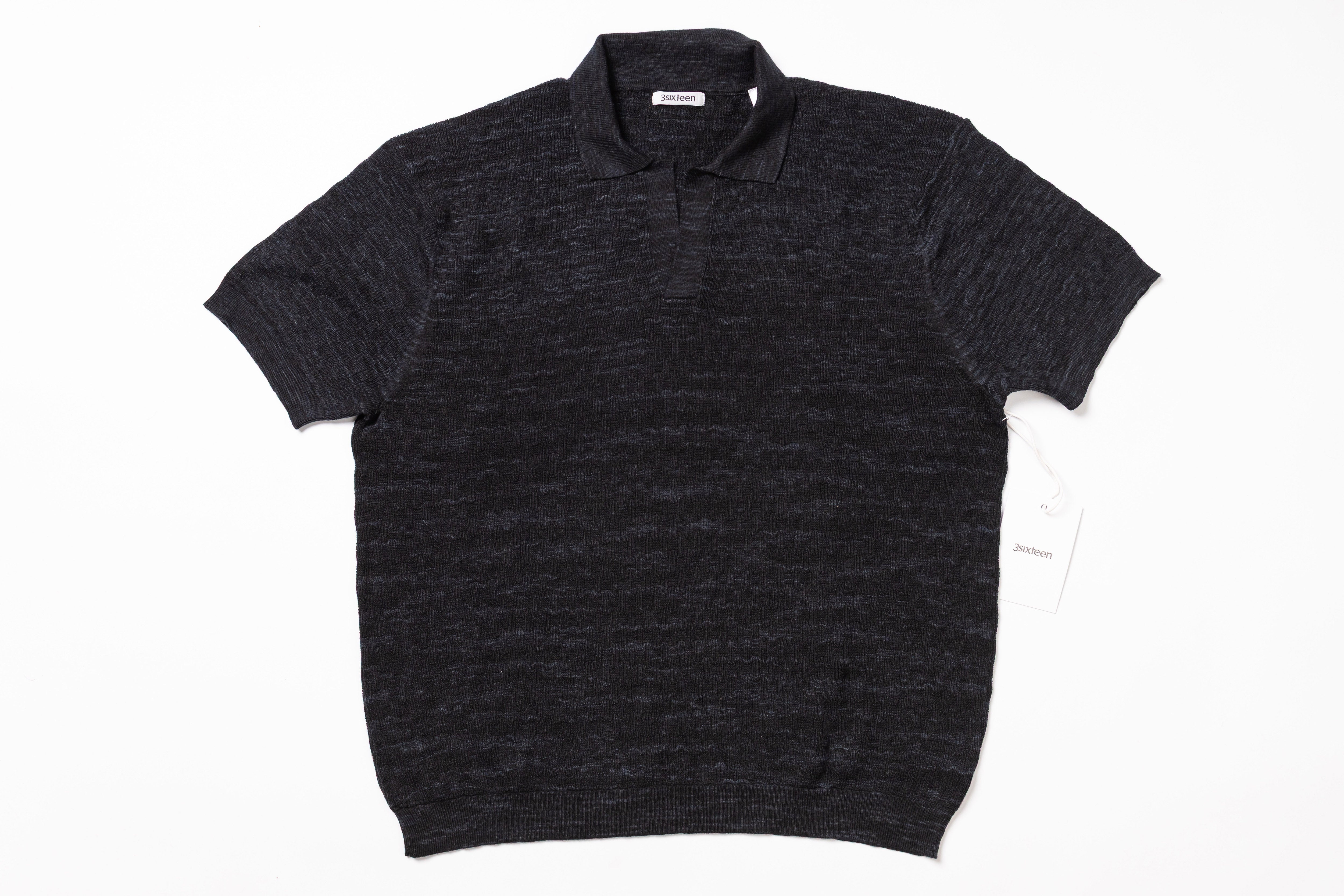 Dark gray polo shirt on a white background