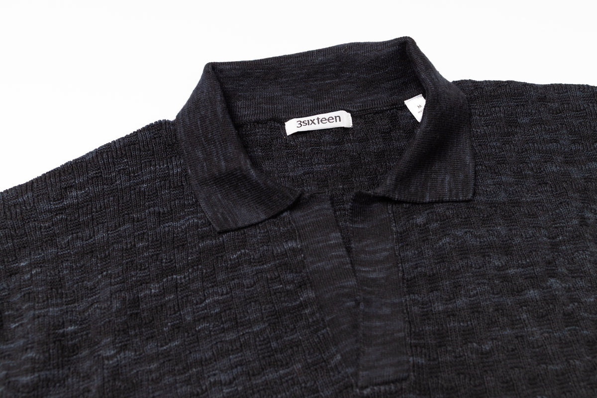 Dark gray polo shirt with collar and '3sixteen' brand label on a white background