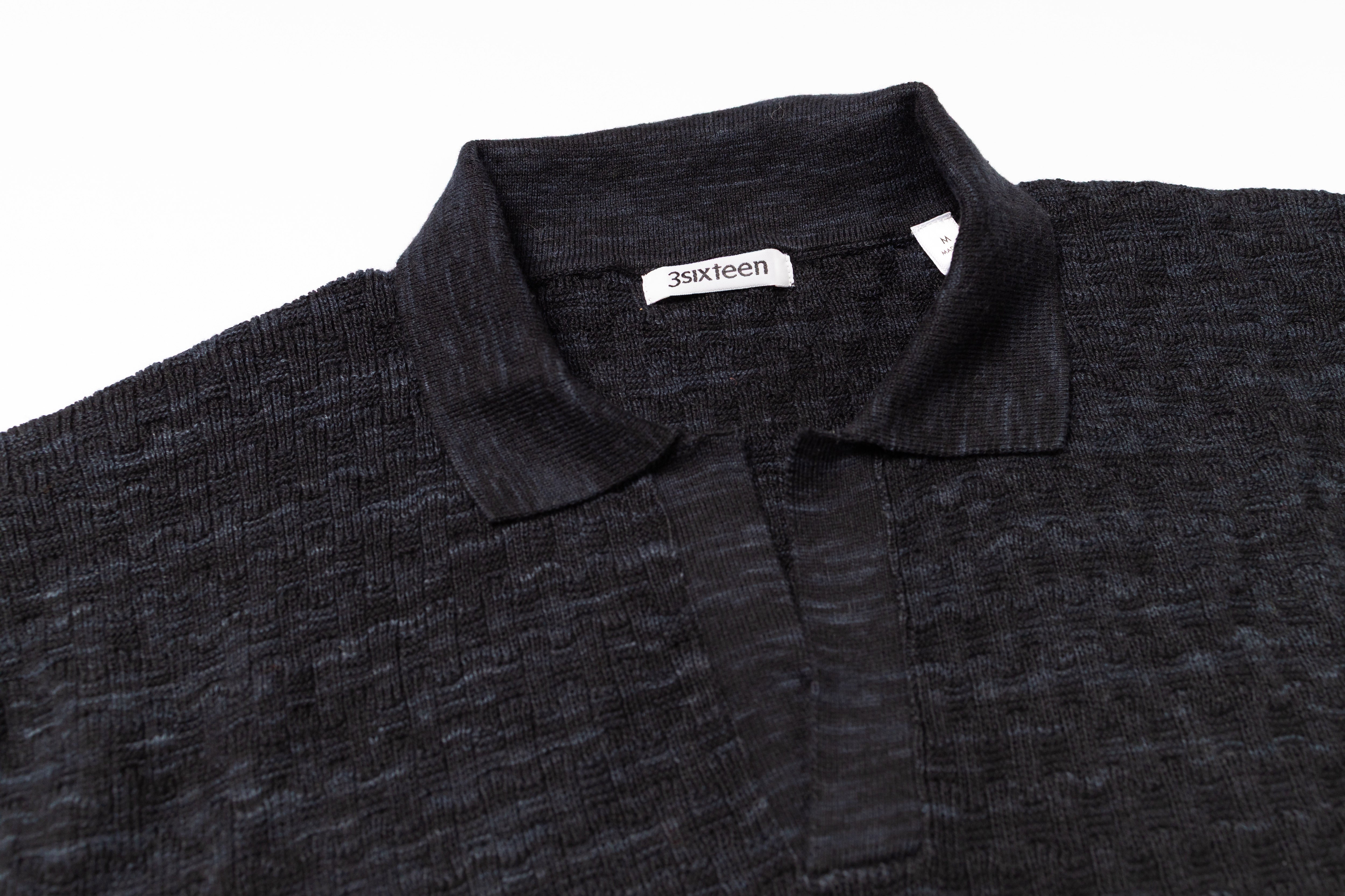 Dark gray polo shirt with collar and '3sixteen' brand label on a white background