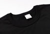 Black t-shirt with a brand label on a white background