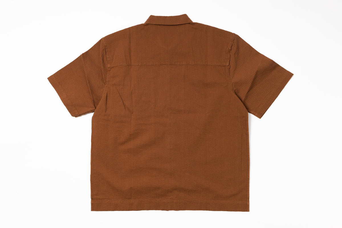 Brown shirt on a white background