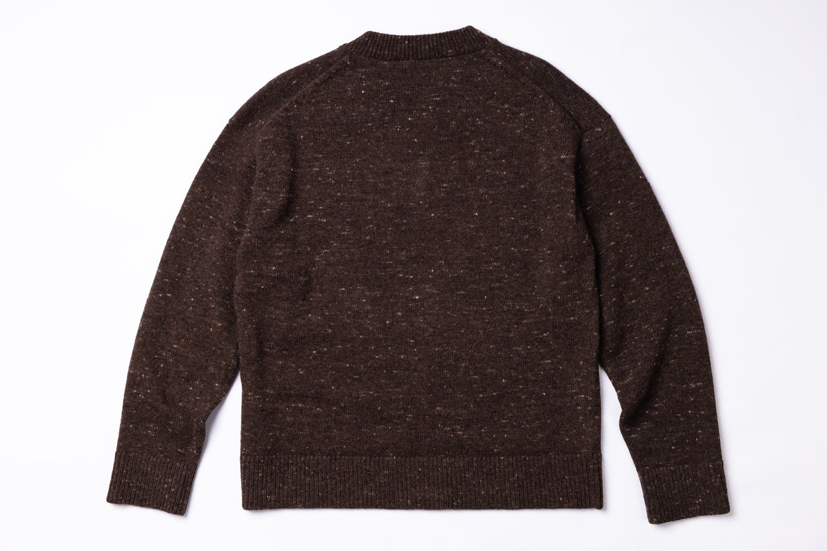 A dark brown long-sleeve knit sweater with a subtle heathered texture, shown from the back on a plain white background.