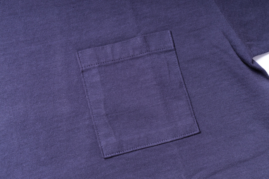 Close-up of a purple t-shirt with a pocket
