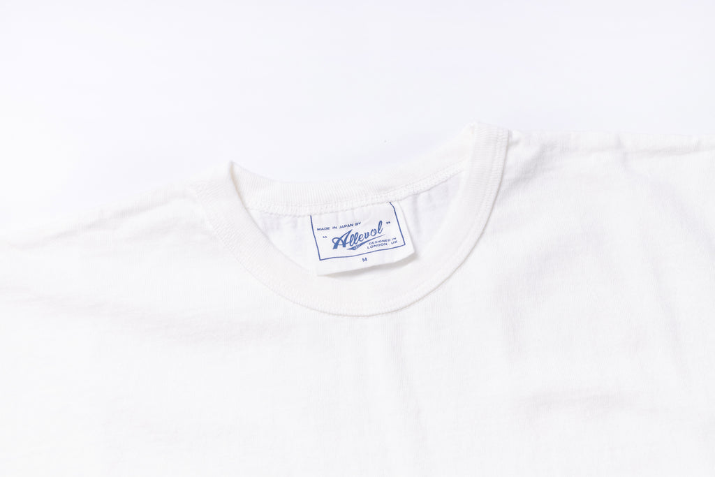 White t-shirt with a brand label on a white background