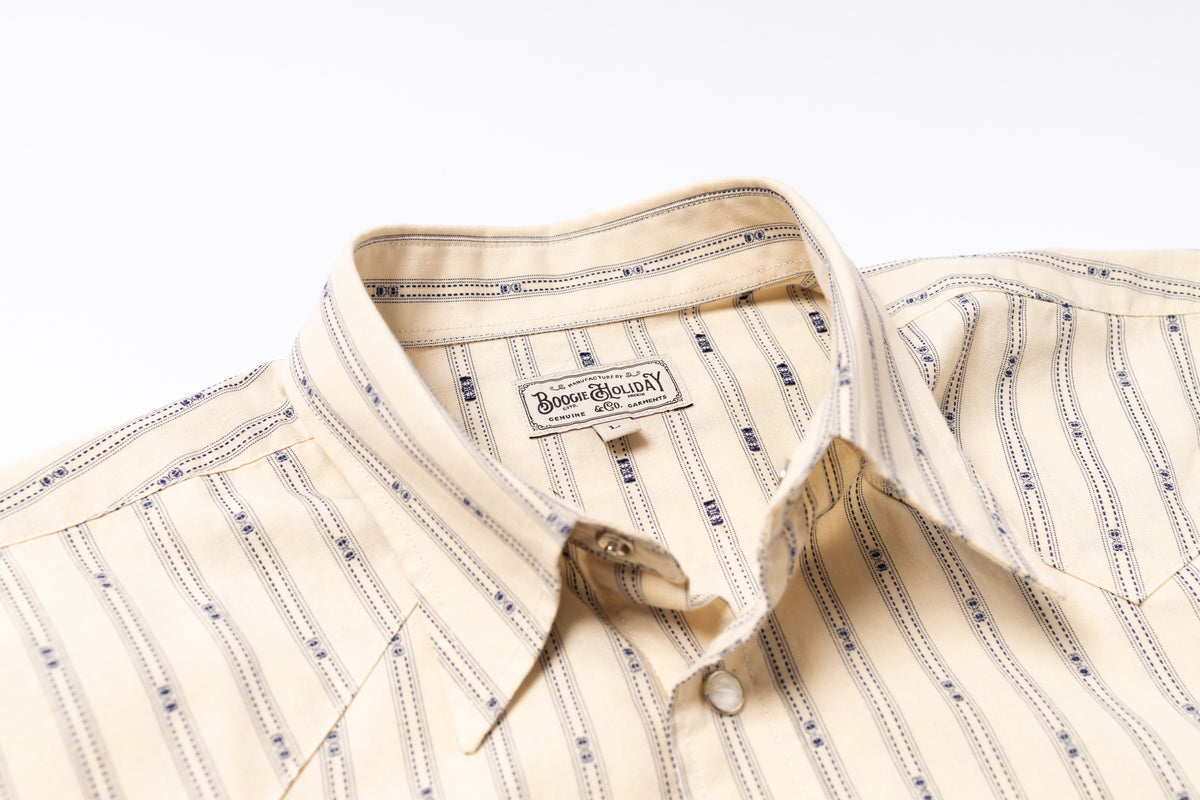 Beige striped shirt with a brand label on a white background
