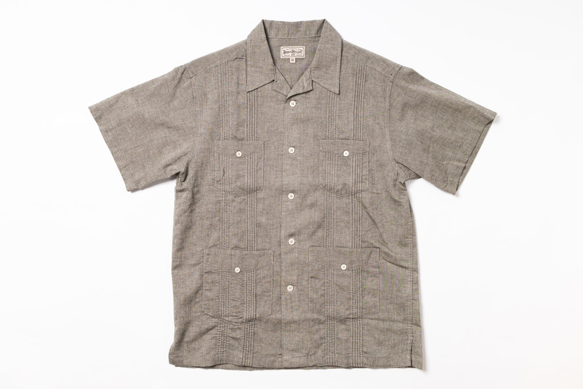Short-sleeve shirt with button details on a white background