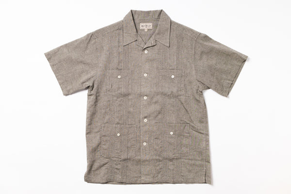 Short-sleeve shirt with button details on a white background