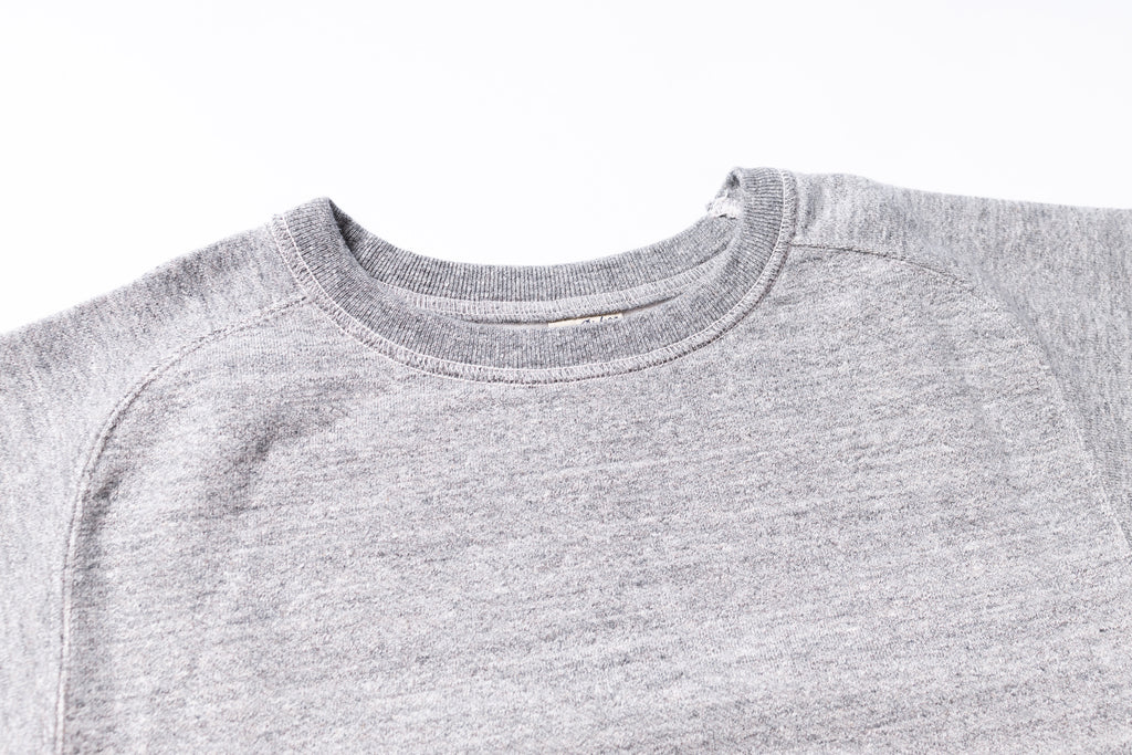 Close-up of a gray sweatshirt collar on a white background