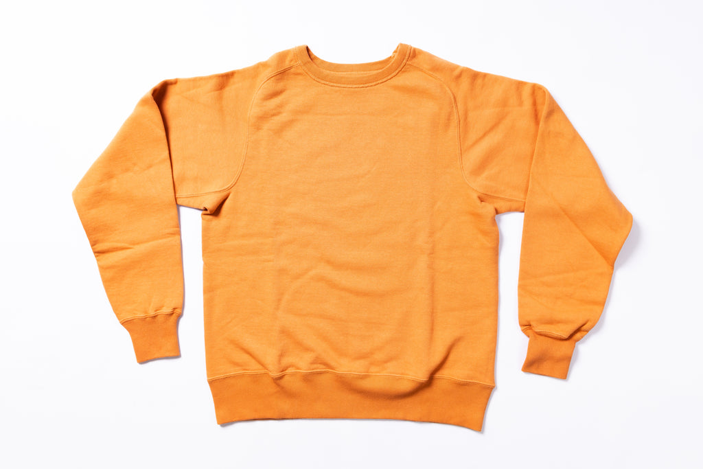 Orange sweatshirt on a white background