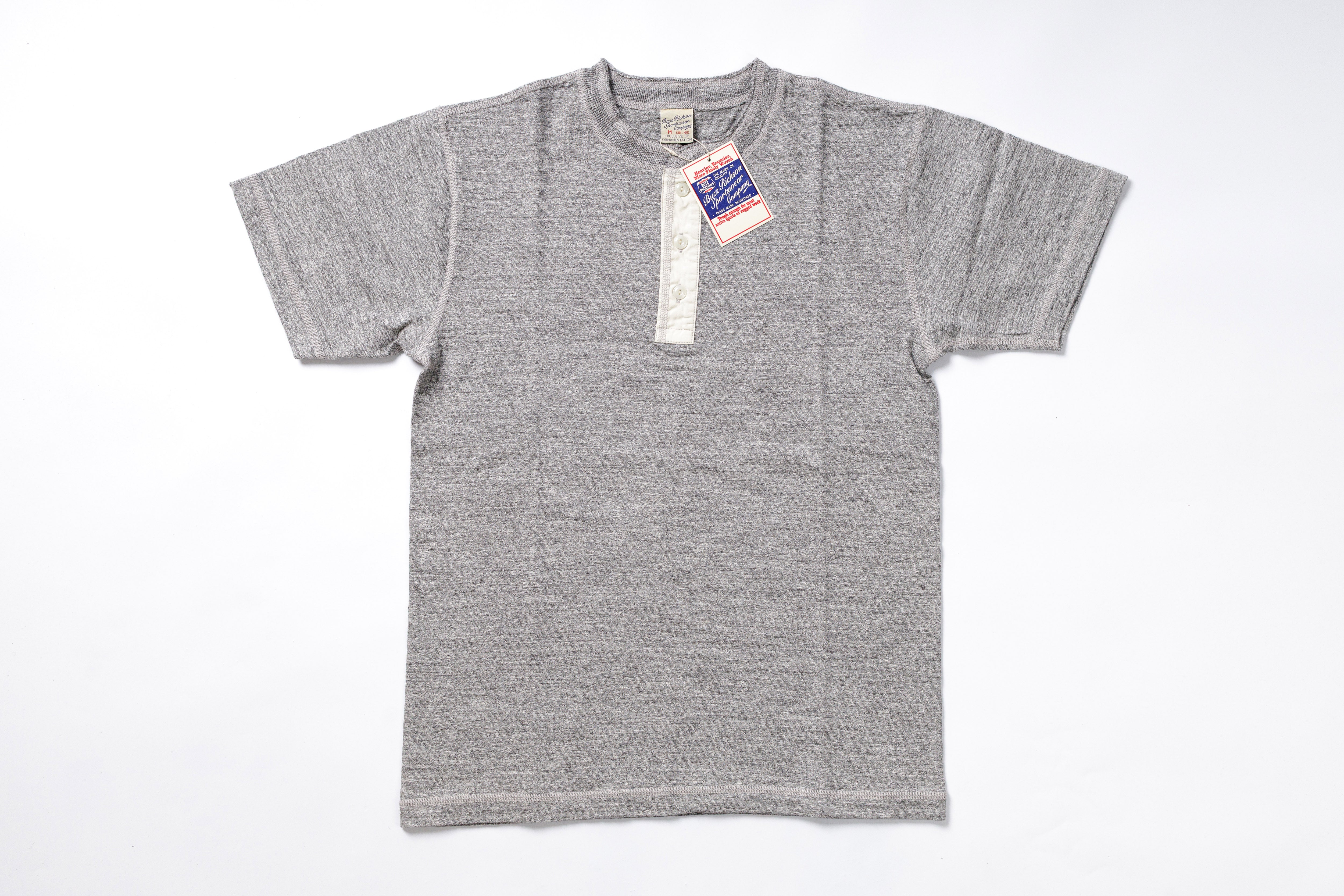 Gray t-shirt with a tag on a white background