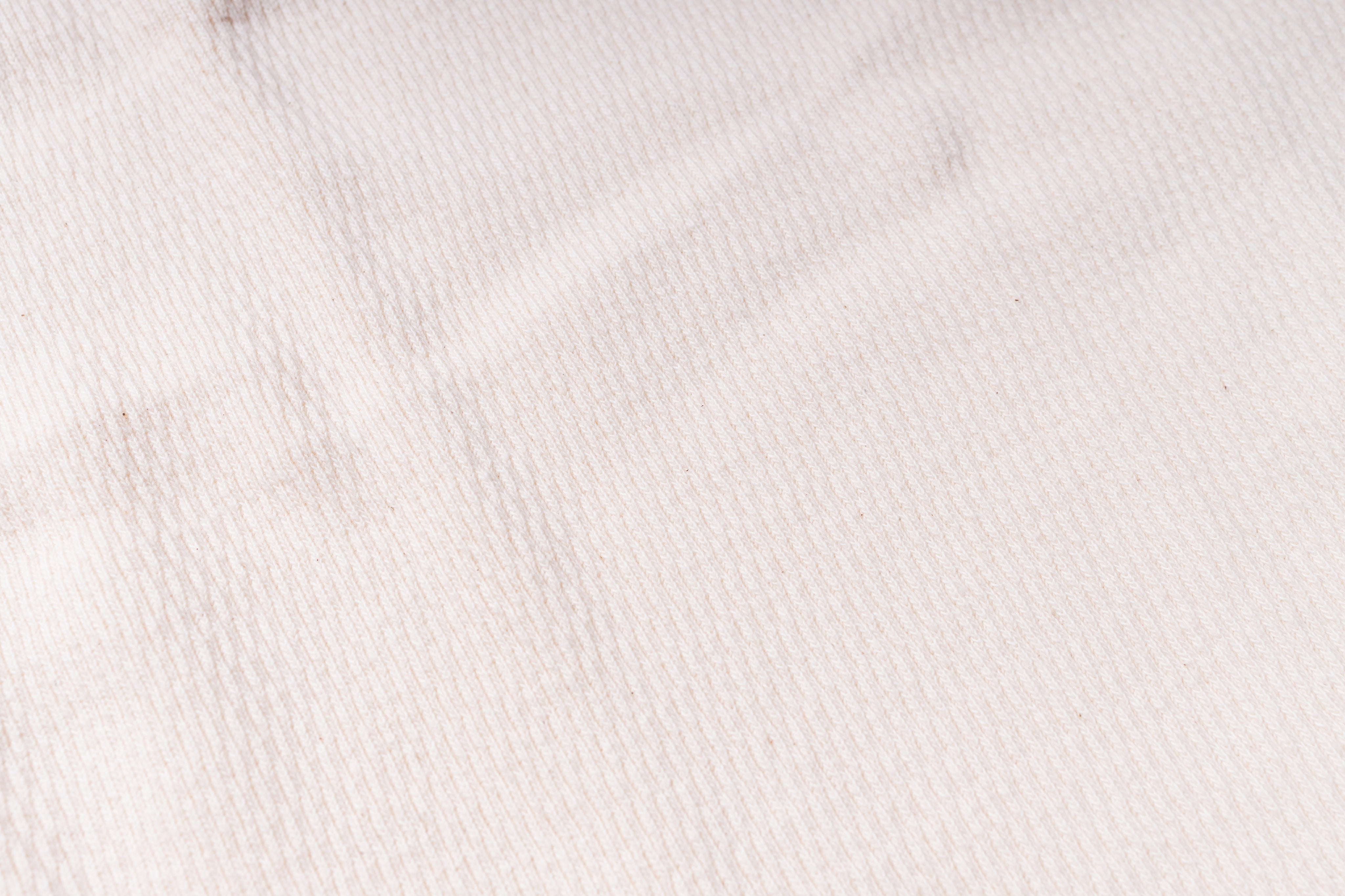 Close-up of a textured white fabric surface