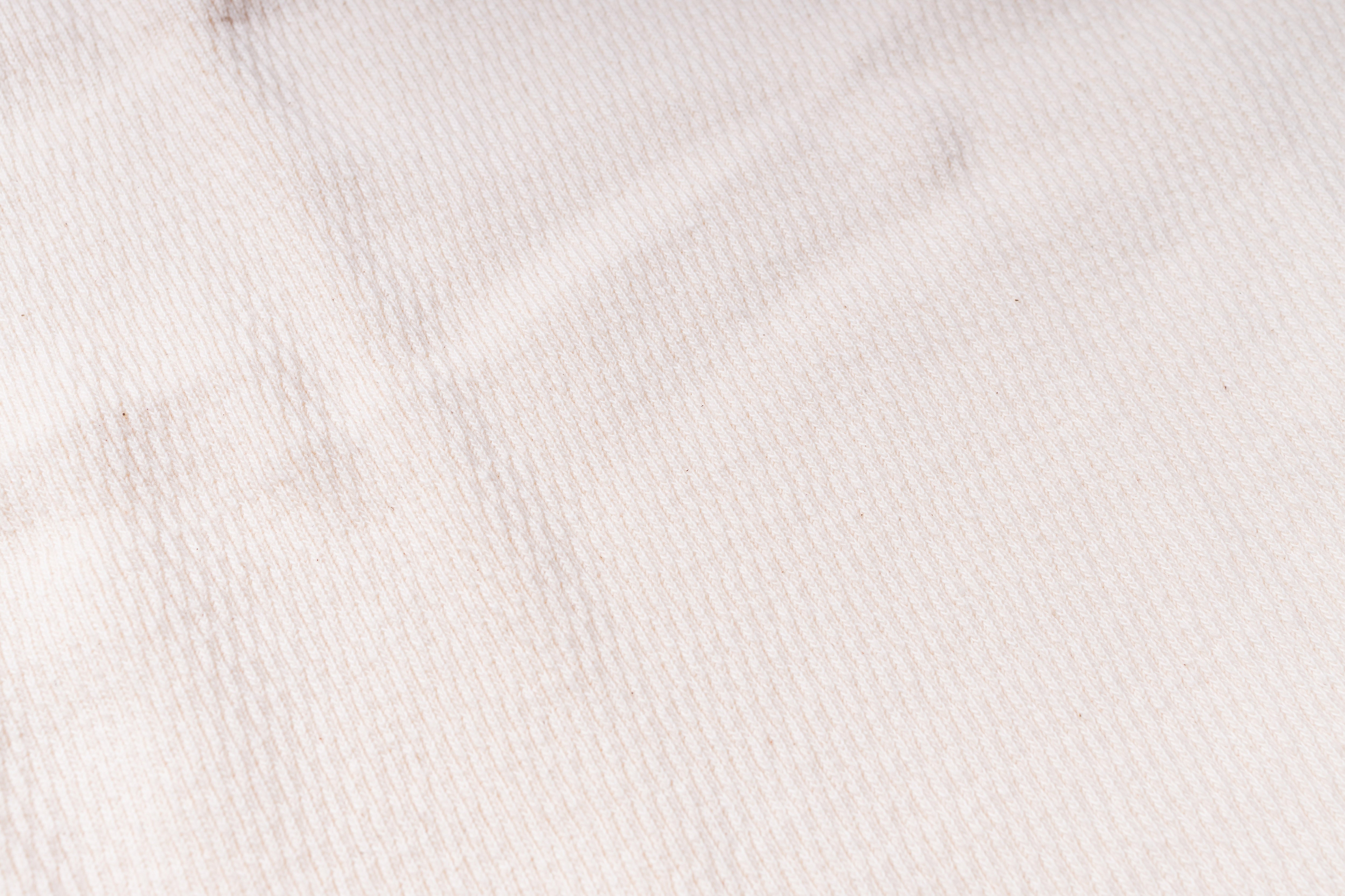 Close-up of a textured white fabric surface