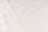 Close-up of a textured white fabric surface