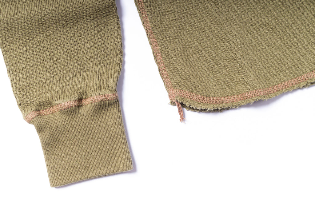 Close-up of green fabric with a white background