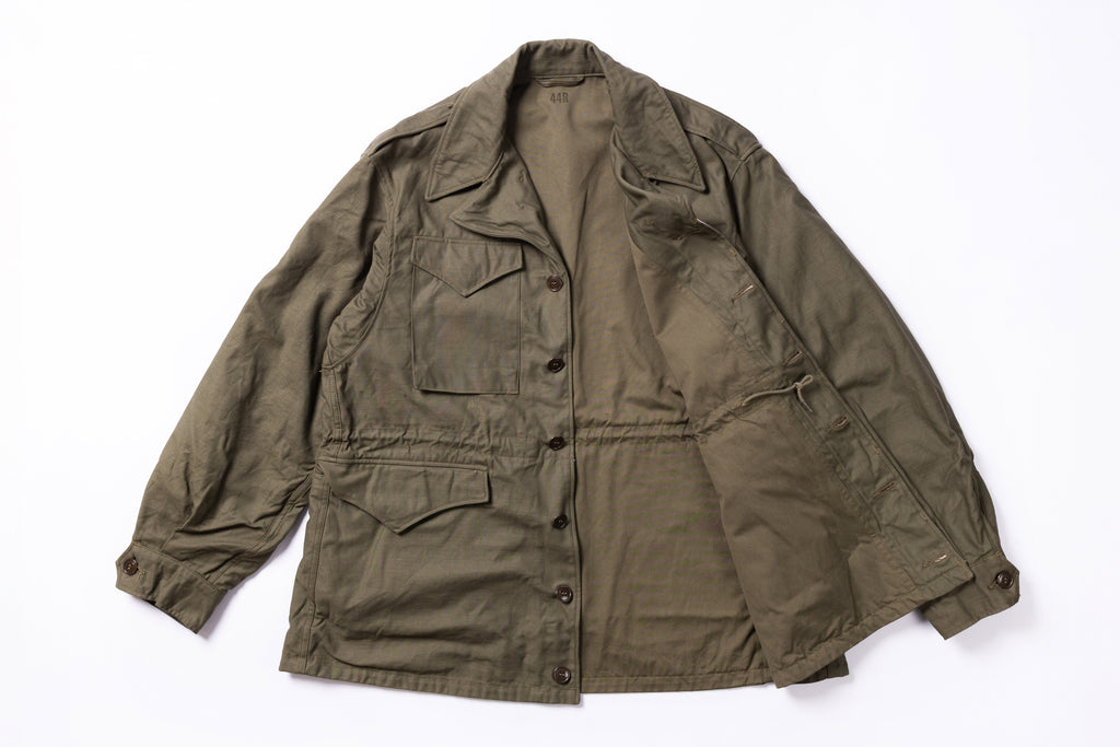 Olive green jacket on a white background