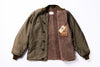 Green jacket with brown lining and a visible brand tag on a white background