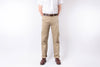 Person wearing beige pants and a white shirt on a white background