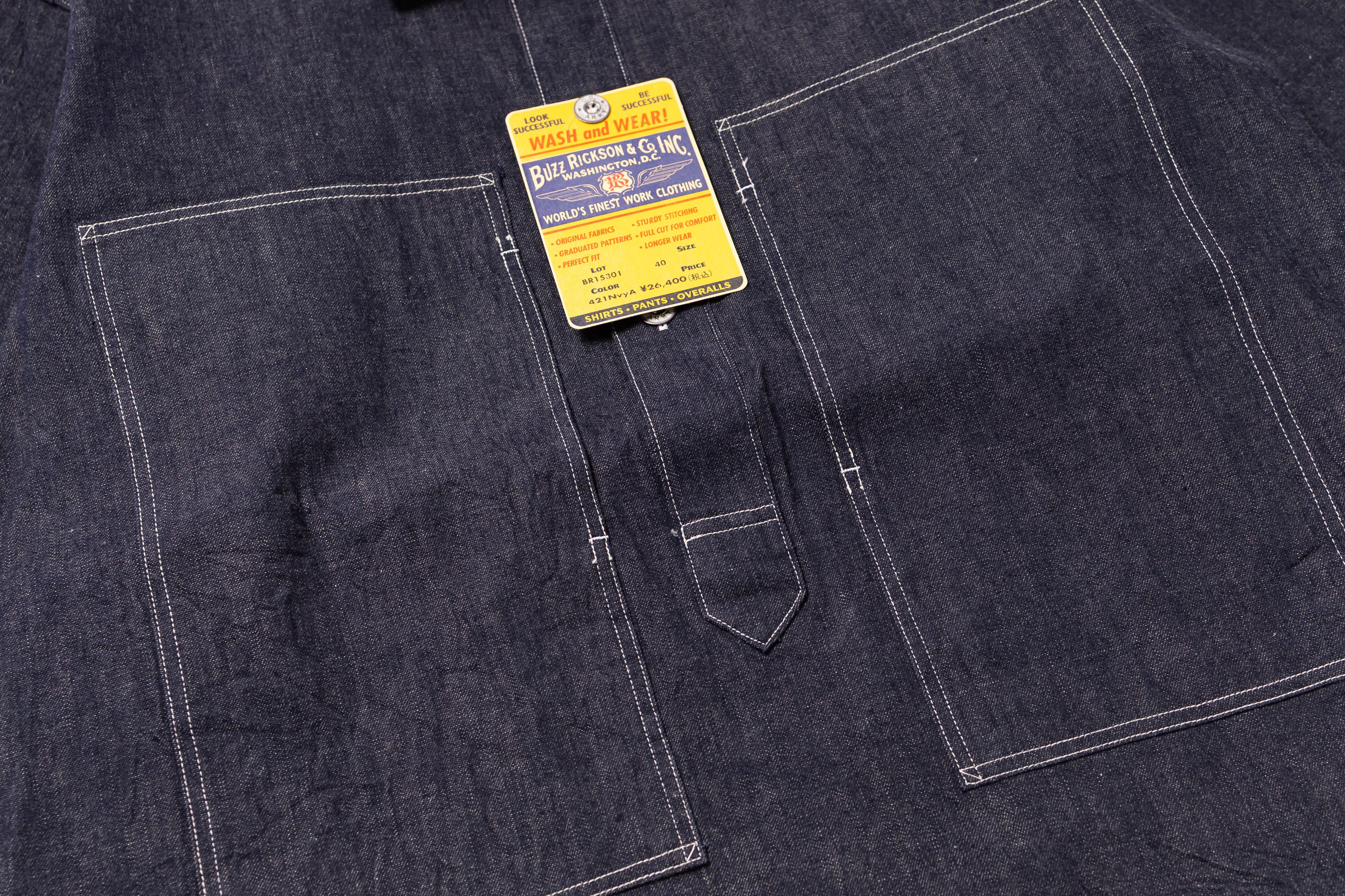 Dark denim fabric with a label on a pocket
