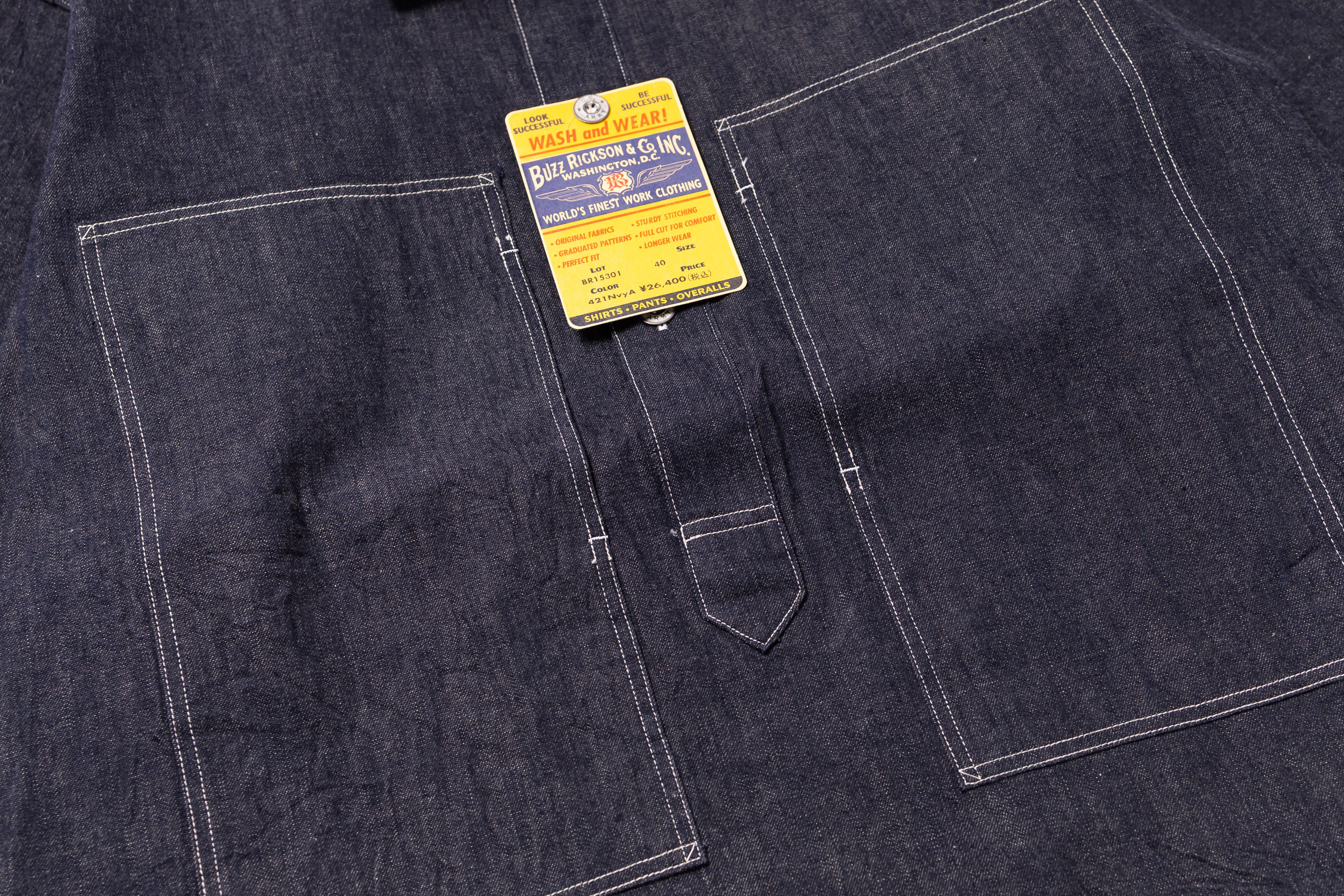 Dark denim fabric with a label on a pocket