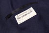 Label on a navy blue garment with 'Naval Clothing Factory' branding.